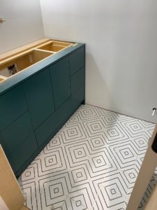 green vanity main bathroom